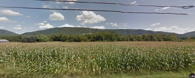 The rock slides and cliffs of Hells' Half Acre and South Mountain, as seen from Route 116. via Google street view. 